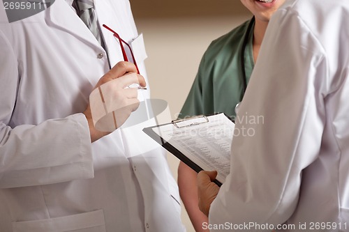 Image of Doctor Holding Clipboard