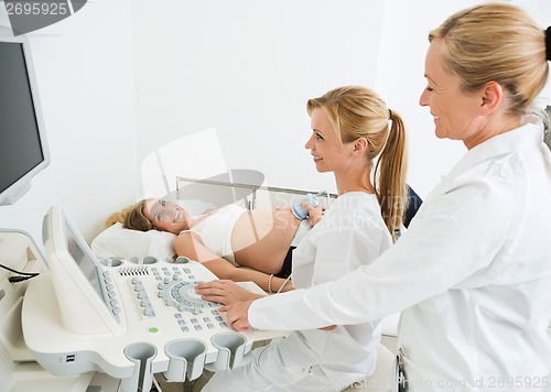 Image of Gynecologists Examining Pregnant Belly By Ultrasonic Scan