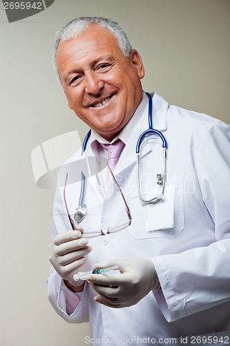 Image of Doctor Holding Sterilized Syringe