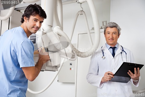 Image of Technician And Radiologist At Clinic