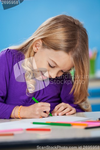 Image of Girl With Sketch Pen Drawing In Kindergarten