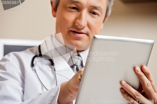 Image of Doctor Using Digital Tablet