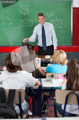 Image of Teacher Looking At Students In Classroom