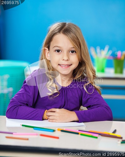 Image of Girl With Sketch Pens And Paper In Kindergarten