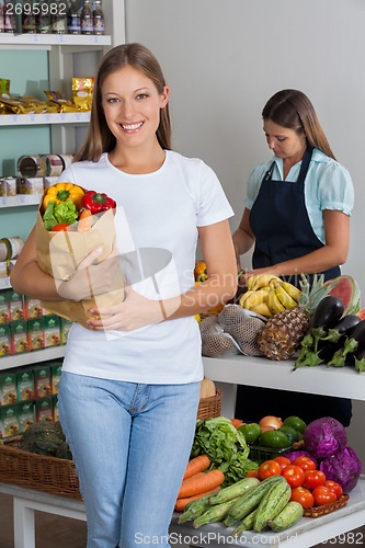 Image of Woman Holding Grocery Bag At Supermarket