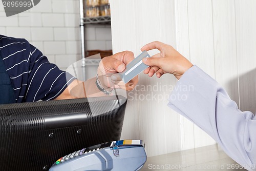 Image of Female Customer Making Credit Card Payment