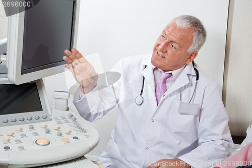 Image of Radiologist Showing Something At Screen