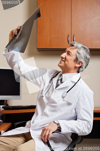 Image of Radiologist Reviewing X-ray At Clinic