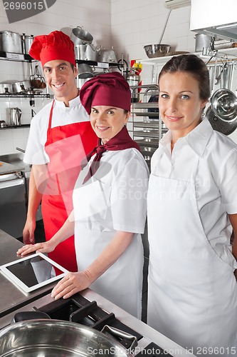 Image of Happy Chefs With Digital Tablet