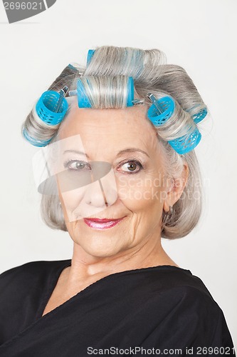 Image of Woman With Hair Curlers