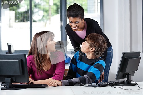 Image of Teacher And Teenage Students In Computer Lab