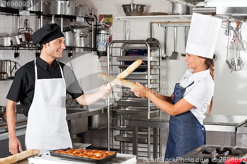 Image of Chefs Fighting With Bread Loafs