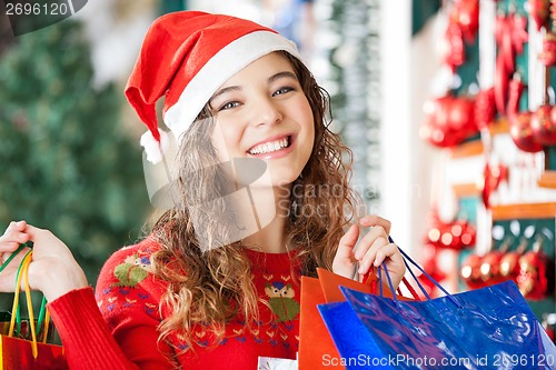 Image of Happy Woman Carrying Shopping Bags At Store