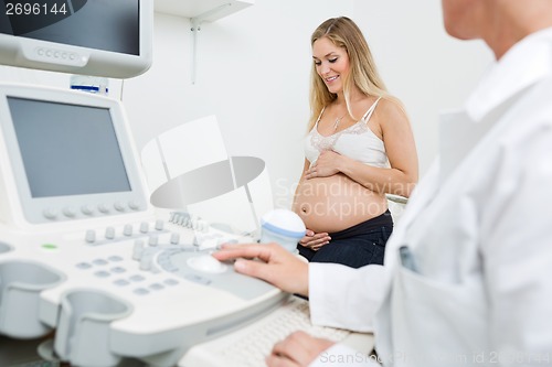 Image of Pregnant Woman With Obstetrician In Clinic