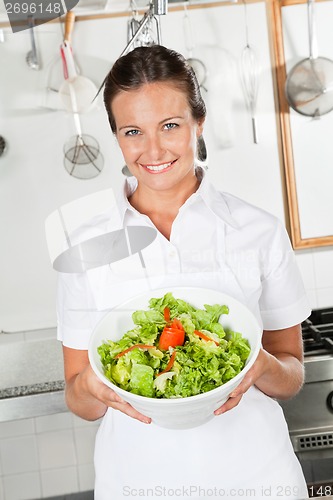 Image of Female Chef Showing Vegetable Salad