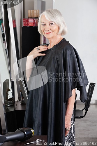 Image of Senior Female Customer Standing At Salon