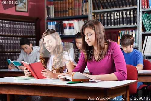 Image of Teenage Students Studying In Library