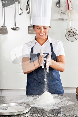 Image of Female Chef Kneading Dough