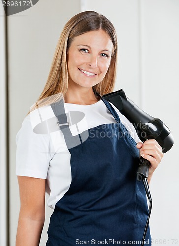 Image of Female Hairstylist Holding Hairdryer