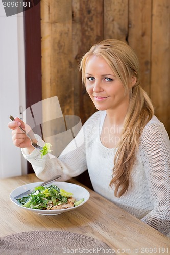 Image of Young Woman With Plate Of Salad In Restaurant