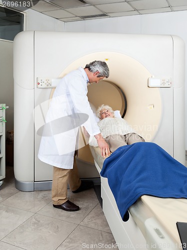 Image of Doctor Preparing Woman For CT Scan Test