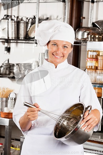 Image of Female Chef With Wire Whisk And Mixing Bowl
