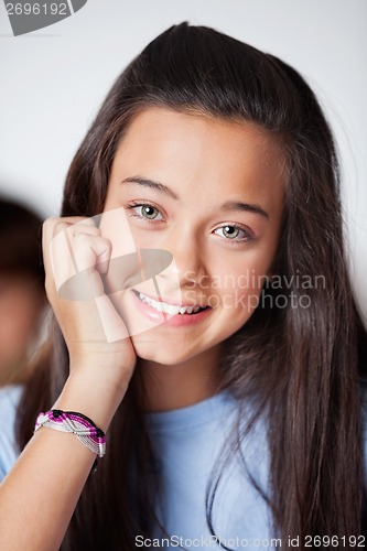 Image of Beautiful Teenage Schoolgirl In Smiling Classroom