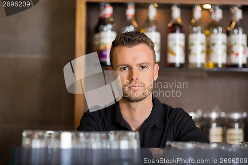 Image of Confident Male Bartender At Cafe