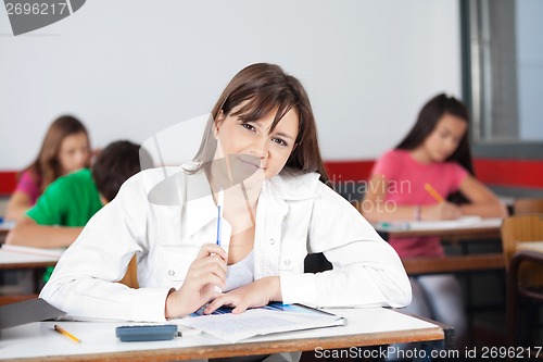 Image of Female Student Sitting In Classroom