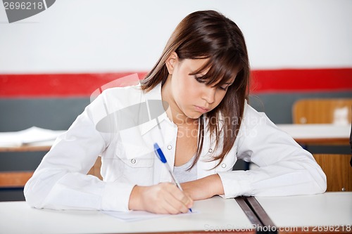 Image of Teenage Schoolgirl Writing During Examination