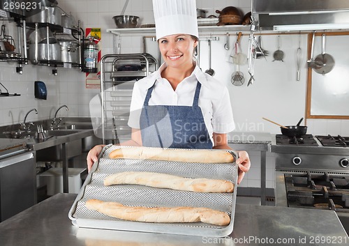 Image of Female Chef Presenting Baked Breads