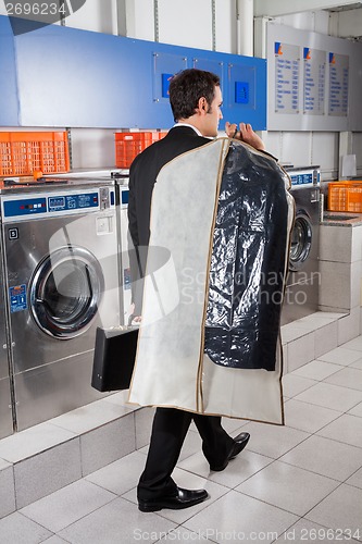 Image of Businessman With Suitcase And Suitcover