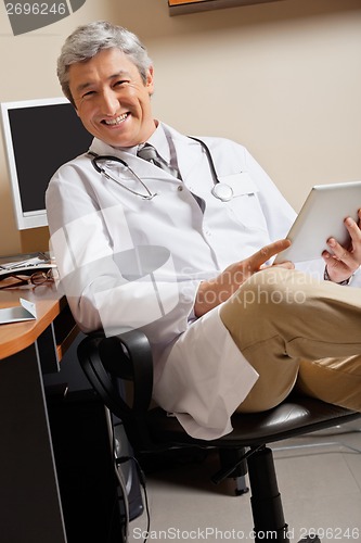 Image of Happy Doctor Holding Digital Tablet