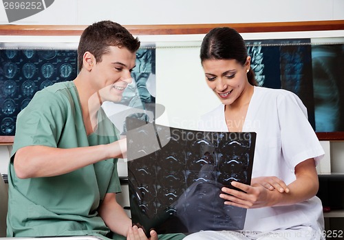 Image of Medical Technicians Reviewing MRI X-ray