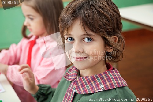 Image of Little Boy Smiling With Classmate In Background