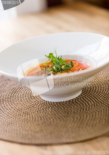 Image of Garnished Tomato Soup On Table