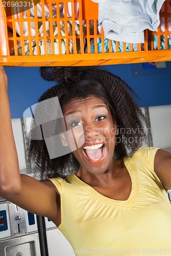 Image of Woman Screaming Carrying Overloaded Basket