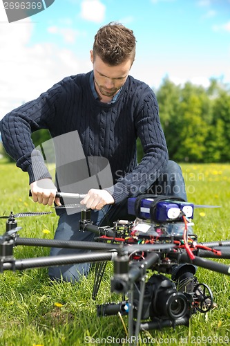 Image of Technician Assembling Propeller Of UAV