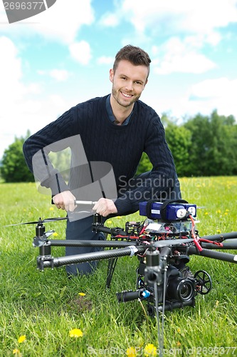 Image of Engineer Fixing Propeller Of Octocopter