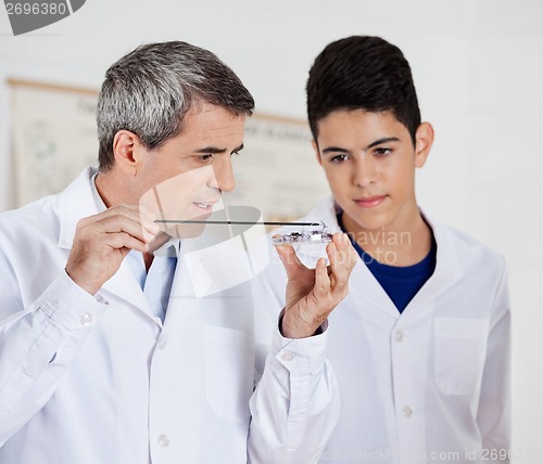 Image of Teacher Teaching Experiment To Students