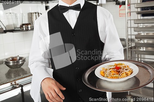 Image of Waiter With Pasta Dish