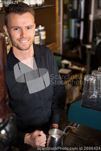 Image of Handsome Young Bartender Working At Cafe