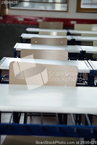 Image of Empty Chairs At Desks