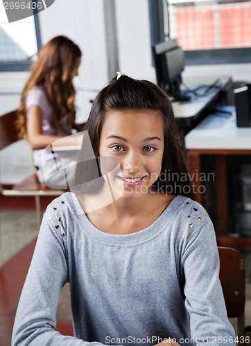 Image of Teenage Schoolgirl Smiling In Computer Class