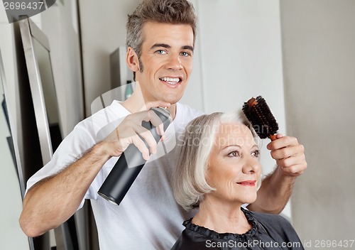 Image of Hairstylist Setting Up Customer's Hair