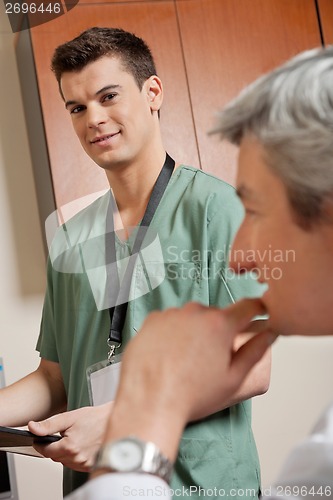 Image of Male Technician With Doctor