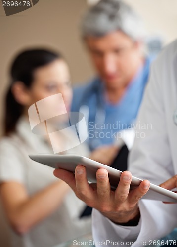 Image of Doctor Using Digital Tablet