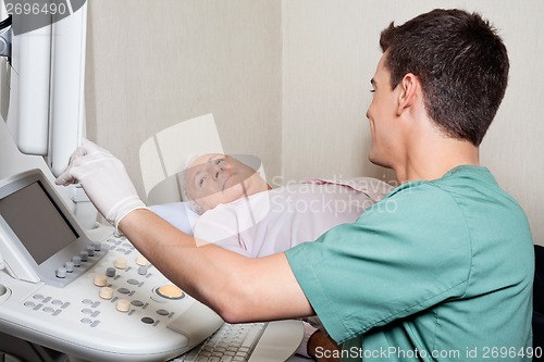 Image of Patient Looking At Ultrasound Machine's Screen