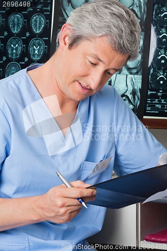 Image of Medical Professional Going Through Document