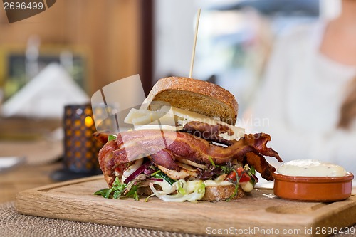 Image of Delicious Sandwich On Wooden Plate